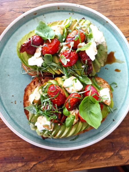 Smashed Avocado, Meredith goats cheese, basil & balsamic roasted cherry toms on Sourdough. 